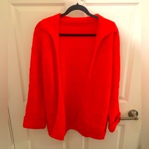 Bright orange cardigan